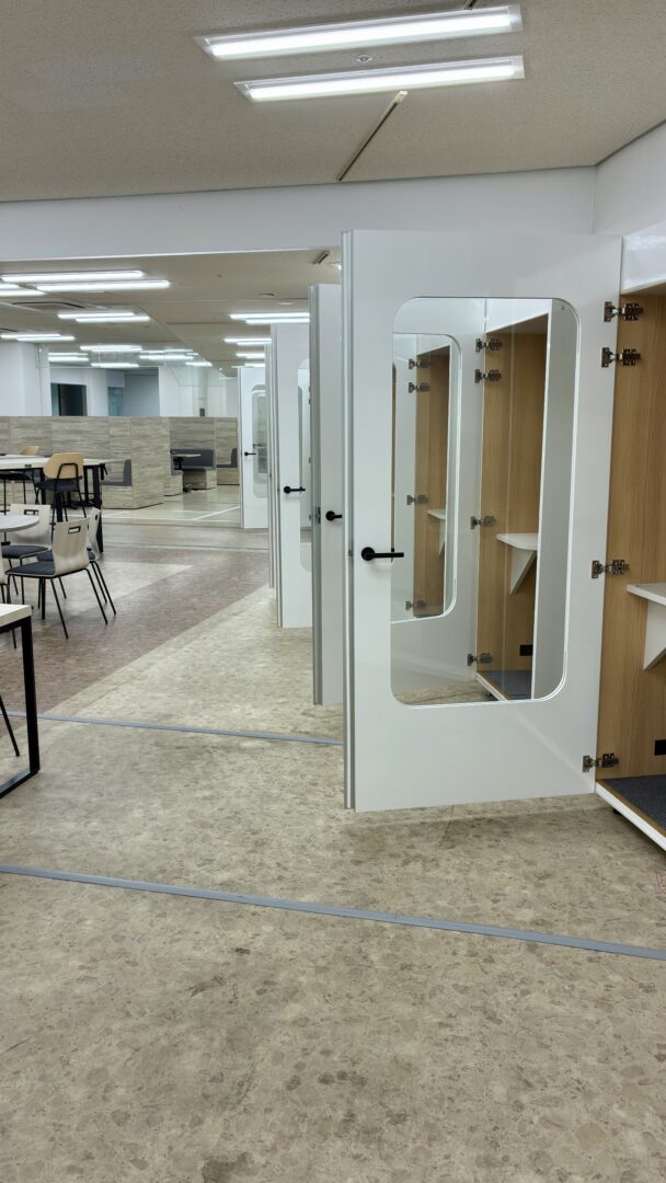 Modern coworking space with private booths and communal areas