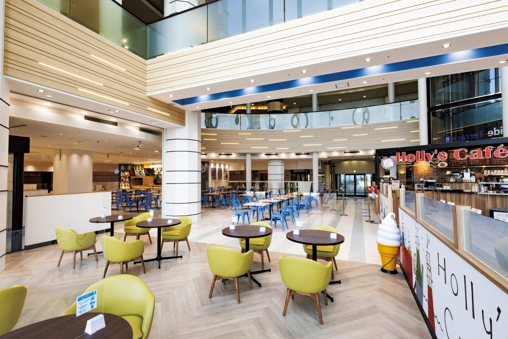 ATC Osaka waterfront restaurant interior with panoramic bay views through large windows and modern table settings